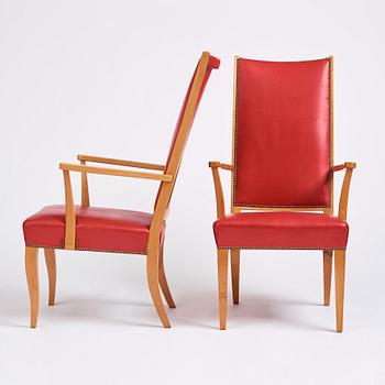 Josef Frank, a pair of walnut and red leather easy chairs, Svenskt Tenn, Sweden 1940-60s.