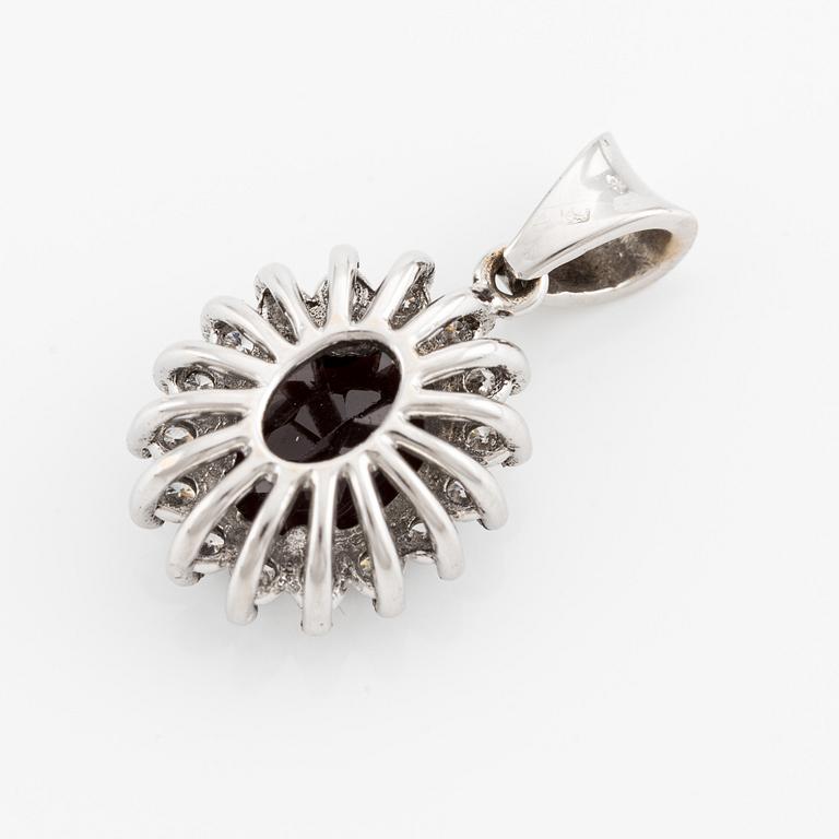 White gold pendant with garnet and brilliant-cut diamonds.