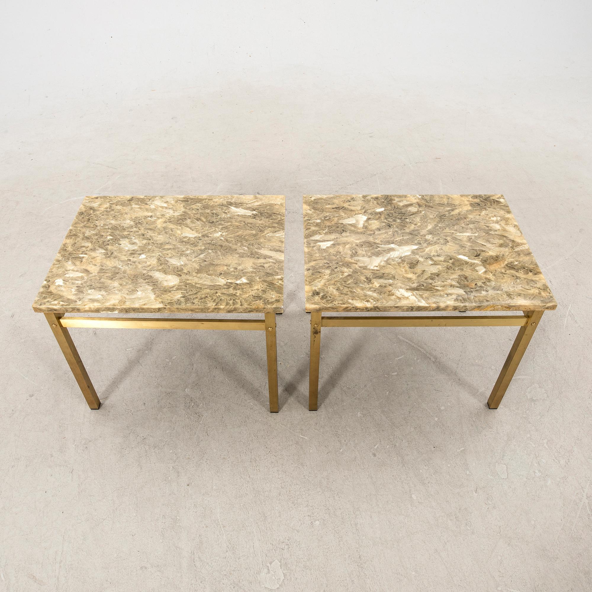 A pair of metal and stone side tables from the second half of the 20th century.