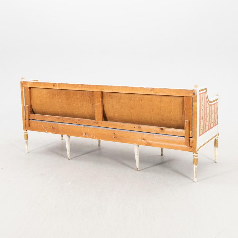 A painted and guilded late gustavian sofa from the 19th century.