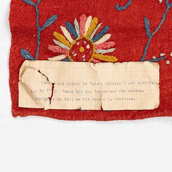 An embroided wool bed cover of 'fall of man' design, South west Scania, Sweden, first half of the 19th century.