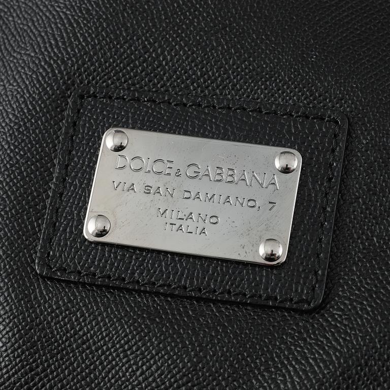 Dolce & Gabbana, a black leather weekend bag.
