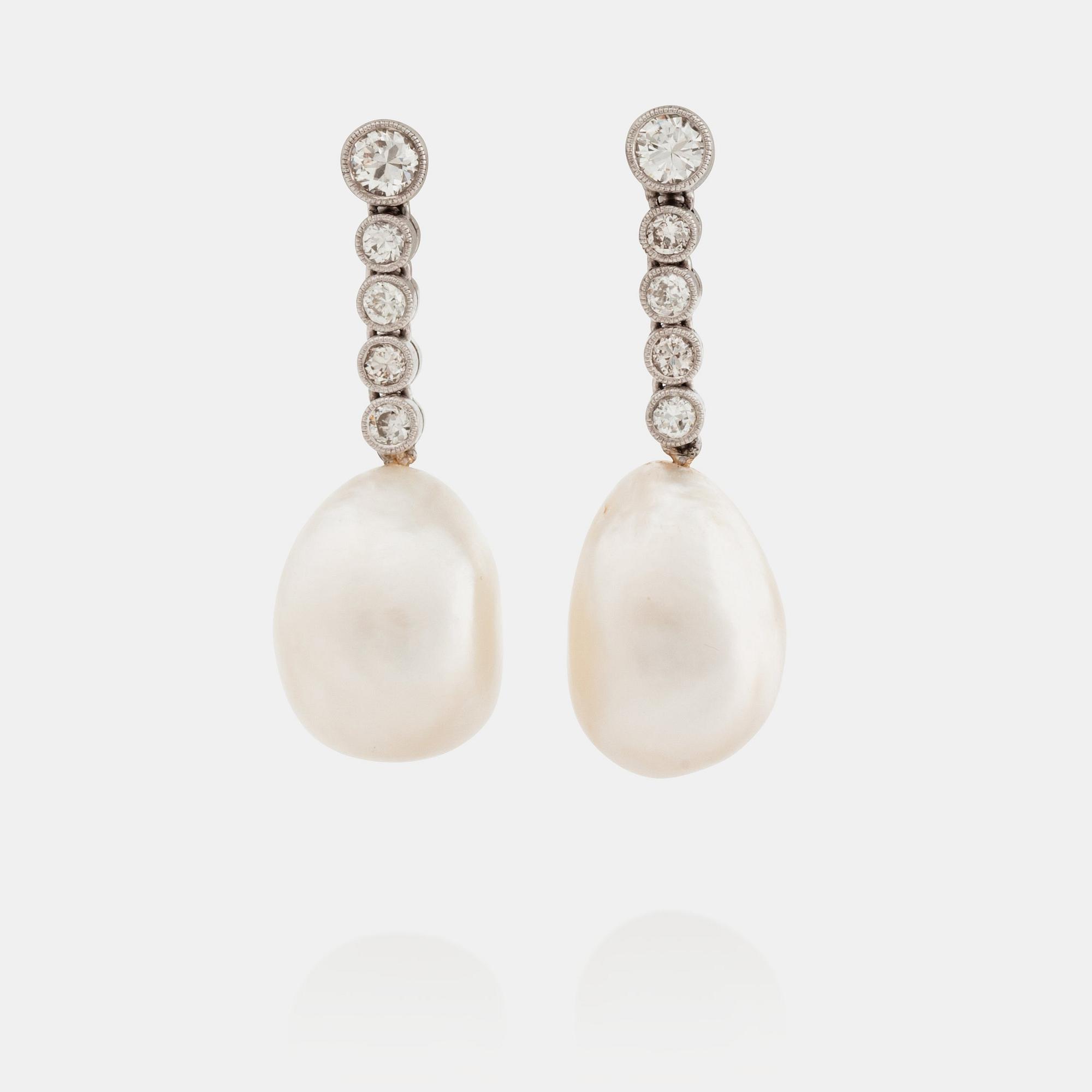 A pair of probably natural pearl and diamond earrings. Total carat weight of diamonds circa 0.54 ct.