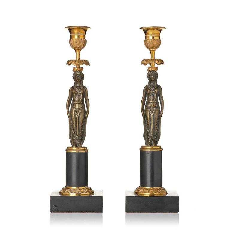 A pair of late Gustavian marble and ormolu candlesticks in the manner of F. L. Rung (1758-1837).