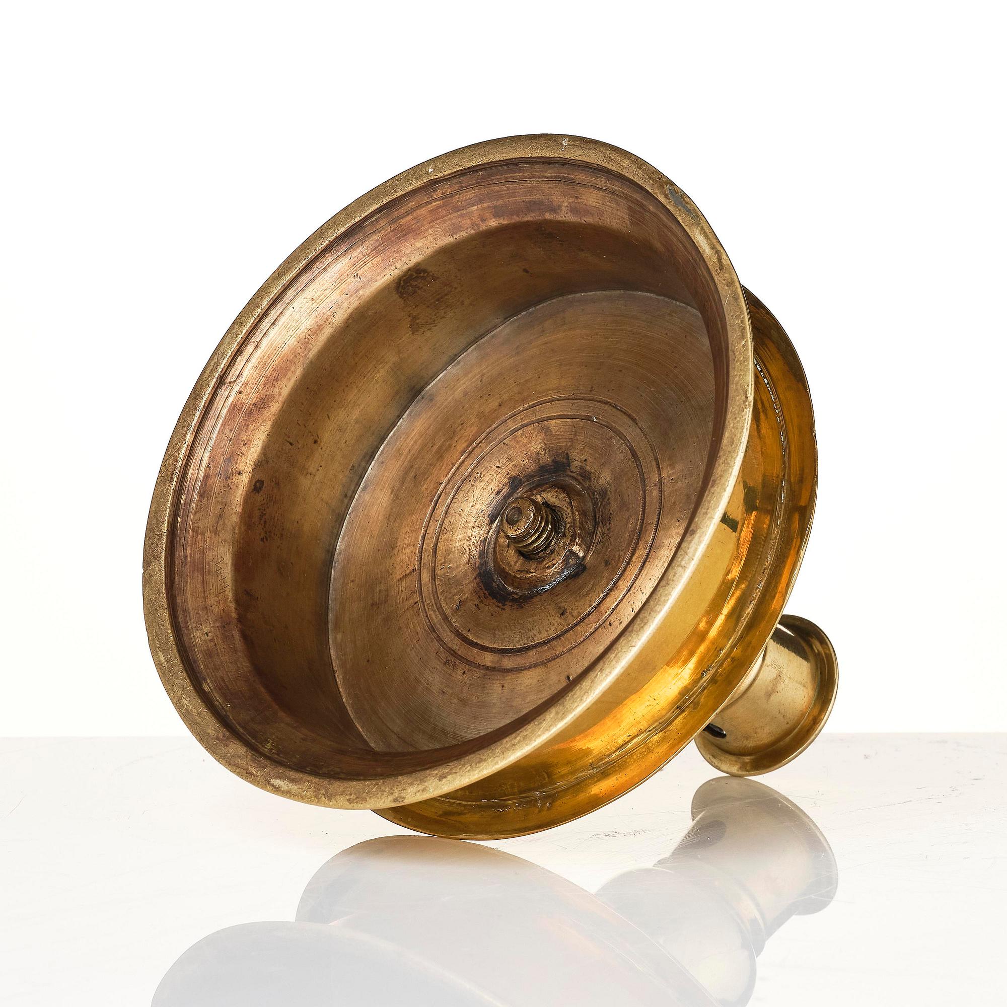 A Northern European baroque brass candlesticsk, late 17th century.