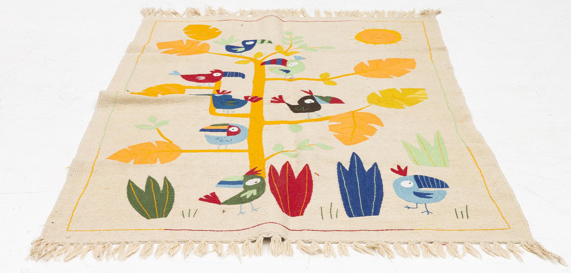 A hand-embroidered Kelim rug, c. 125 x 121 cm.