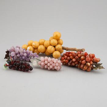 A group of five glass and stone objects, in shapes of fruits, 20th century.