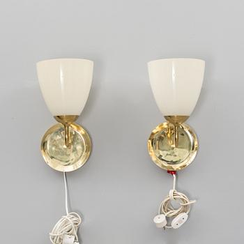 A pair of wall lights manufactured by Taito in the 1940s.