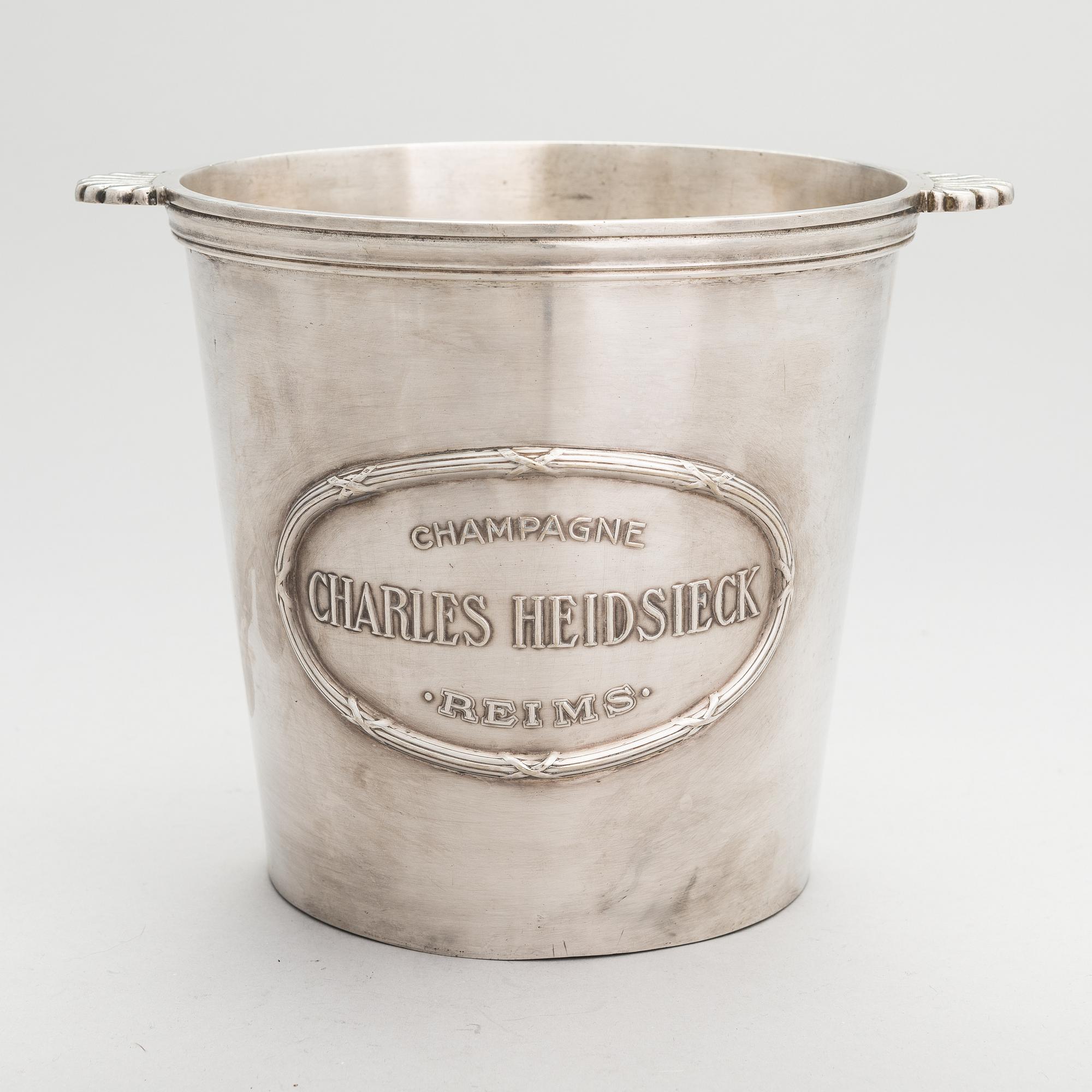 A silver plated brass Charles Heidsieck Champagne cooler.