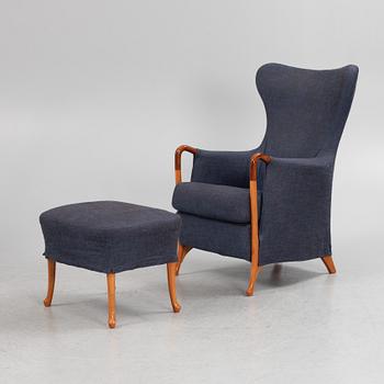 Umberto Asnago, a 'Progetti' armchair with a footstool, Giorgetti, 2000s.