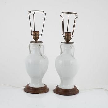 A pair of white porcelain table lamps / urns, Europe 20th century.