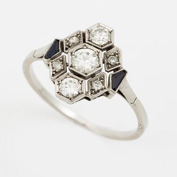 A platinum ring set with round brilliant-cut diamonds and sapphires, Art Déco.