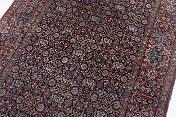 A rug, probably Meshed, semi-antique, c. 180 x 125 cm.