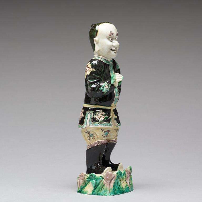 A famille noir figure of a man, Qing dynasty, Kangxi (1662-1722).