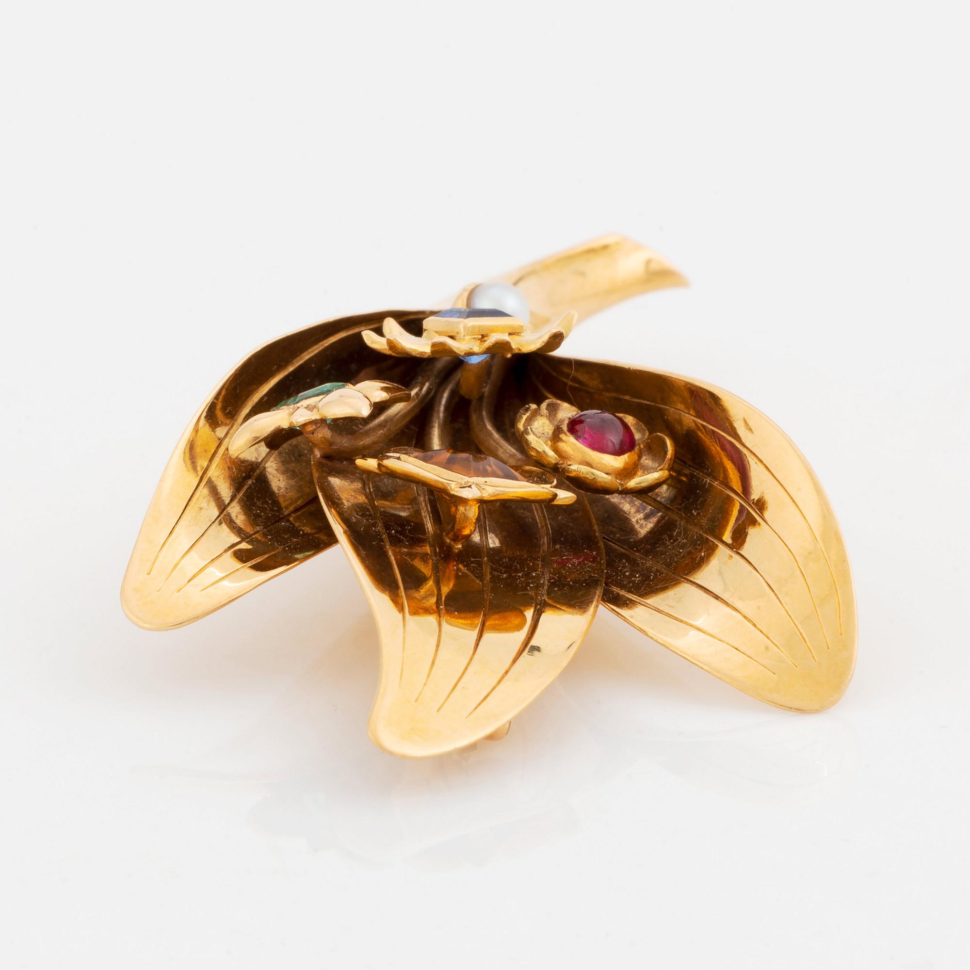 An 18K gold Borgila brooch set with coloured gemstones and a pearl.