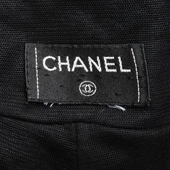 CHANEL, a black mesh evening pant.