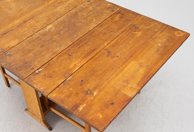 A drop-leaf table, 19th Century.