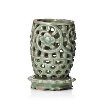 A reticulated lonquan celadon vase/candle holder, Ming dynasty (1368-1644).