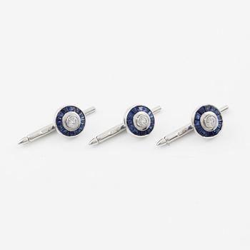 Three shirt buttons in 18K and 14K white gold set with faceted sapphires and round brilliant-cut diamonds.