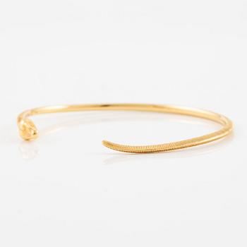 An Ole Lynggaard bracelet 18K gold in the shape of a snake.