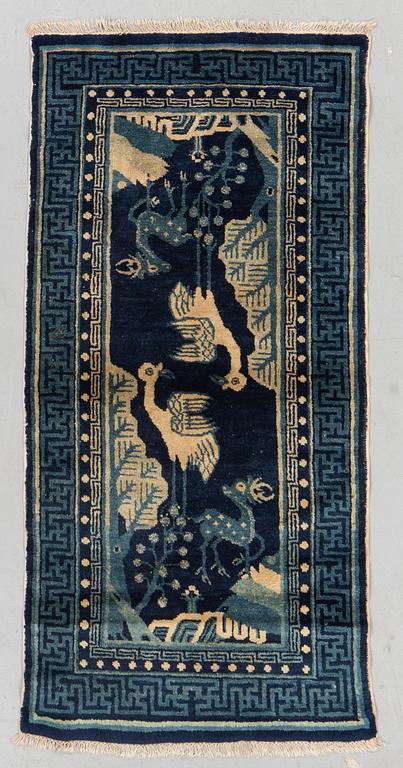 A semiantique Baotou carpet, measurment 130x64 cm.