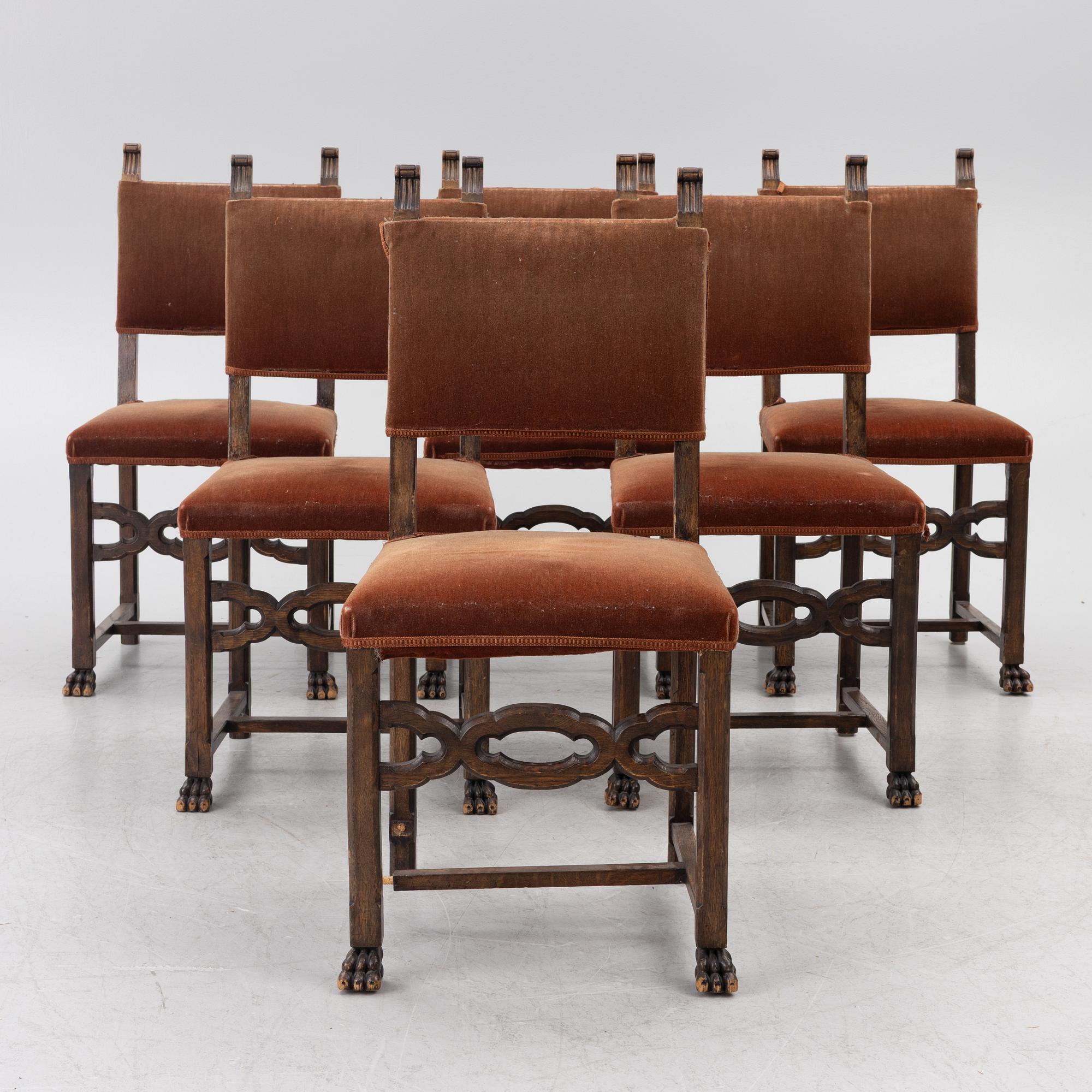 A Baroque-style dining table with six chairs, around 1900.