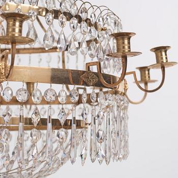 A late Gustavian gilt brass and cut glass thirteen-light chandelier, circa 1800.