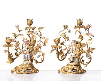 A pair of Meissen Rococo-style three-light candelabra, second half of the 1800's.