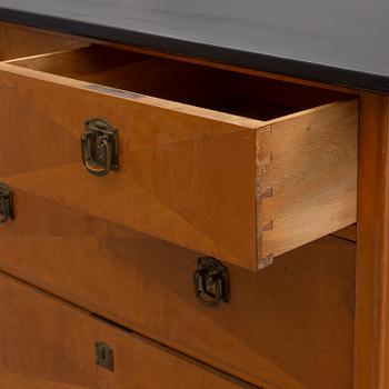 An early 20th century art nouveau chest of drawers.