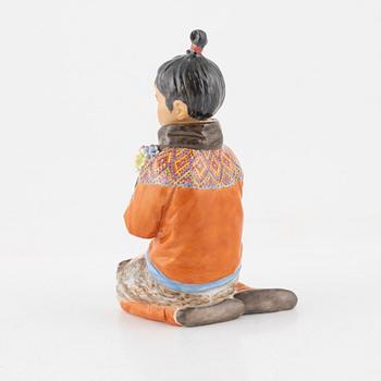A Royal Copenhagen porcelain figure of an innuit from Grönland, Denmark, early 20th Century.