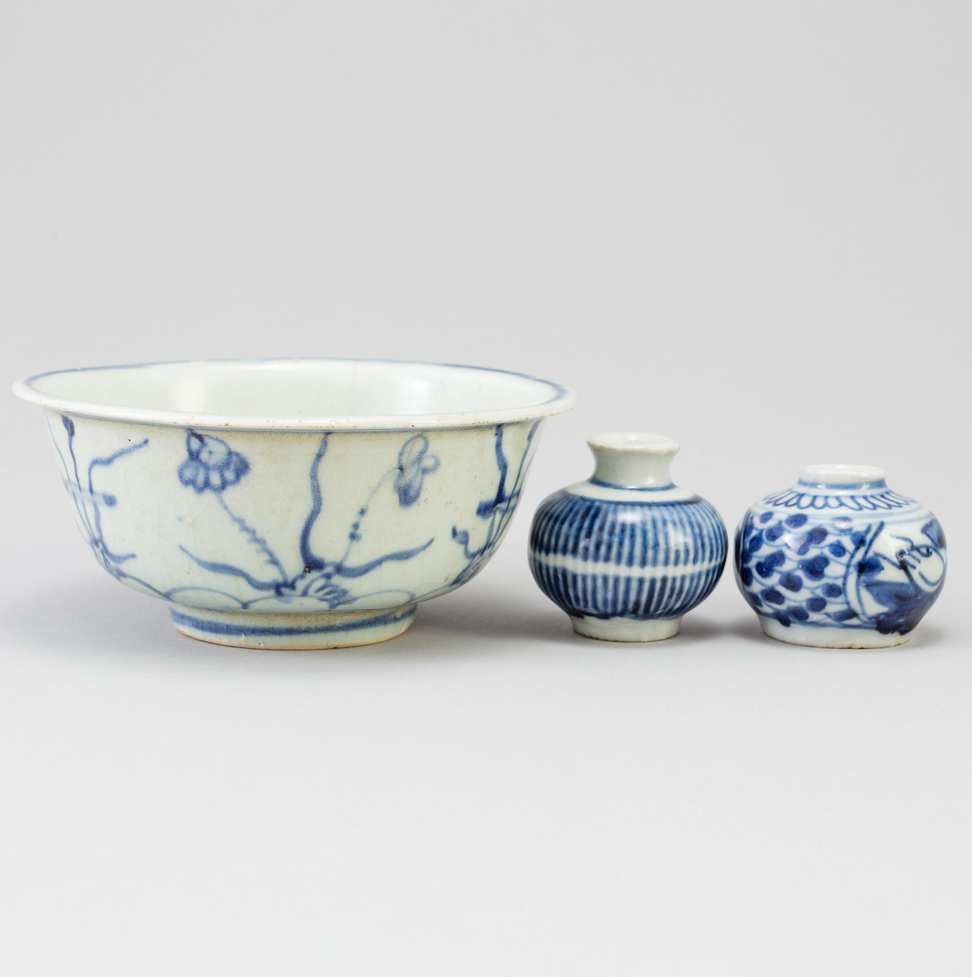 A blue and white Chinese porcelain bowl and two miniature jars for the South East Asian market, probably Ming dynasty.
