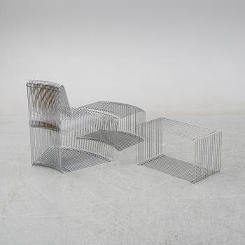 A 'Pantanova convex' chair with foot stool and a 'Wire Extendted' shelf, Verner Panton, Montana, Denmark.