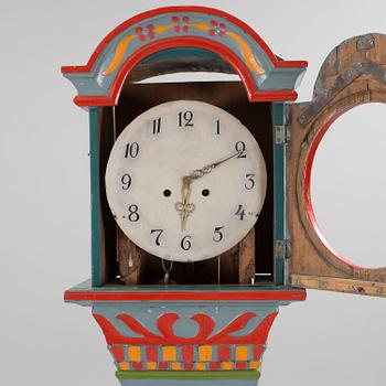 a painted grandfather-clock from the first half of the 19th century.