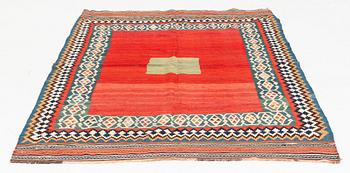 An antique Qashqai kilim rug, approximately 240 x 155 cm.