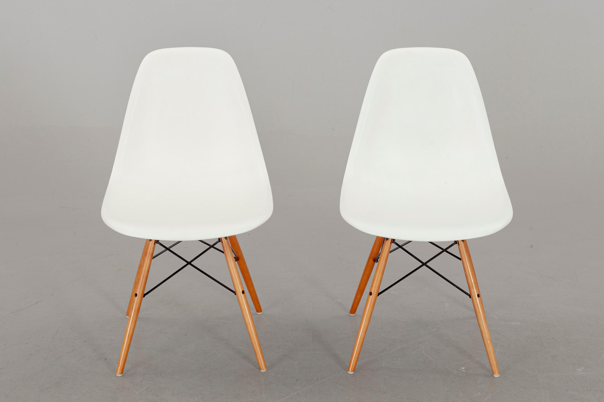 A PAIR OF "PLASTIC CHAIR" BY CHARLES & RAY EAMES, Vitra 2009.