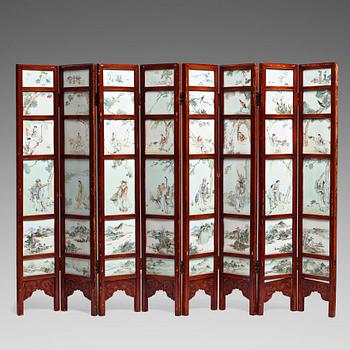 870. A Chinese folding screen with 48 porcelain tiles, late Qing dynasty, signed Ren Huanzhang, and dated 1881.