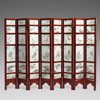 870. A Chinese folding screen with 48 porcelain tiles, late Qing dynasty, signed Ren Huanzhang, and dated 1881.