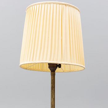 A 1940's brass floor lamp by Harald Elof Notini for Böhlmarks, Sweden 1940's, model 15390.