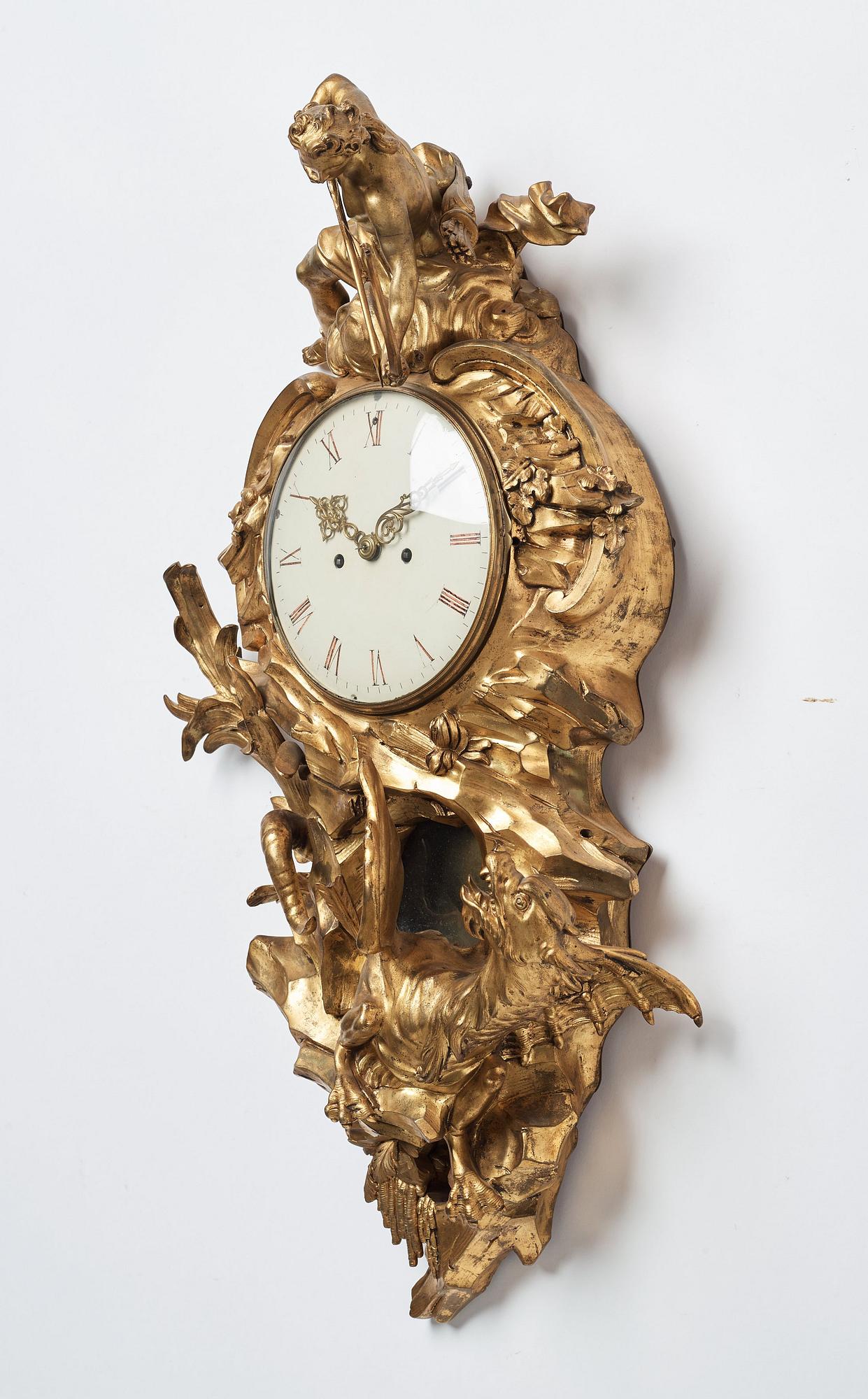 A Louis XV mid 18th century gilt bronze wall clock marked "Caffieri fecit".