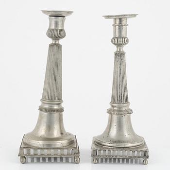 A matched pair of pewter candle sticks, 19th Century.