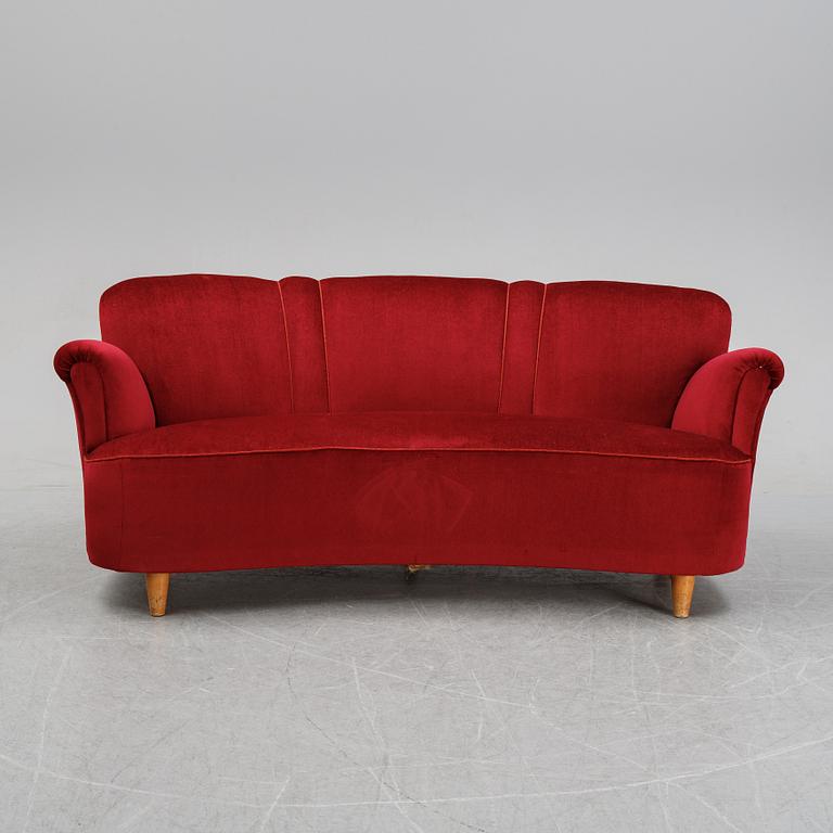 A first half of the 20th Century sofa with velvet upholstery.