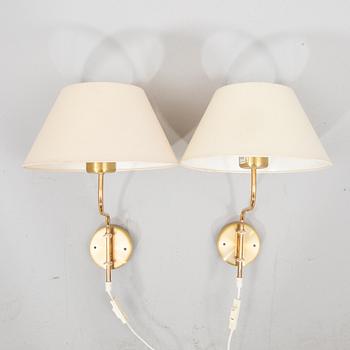 A pair of Belid brass wall lamps later part of the 20th century.