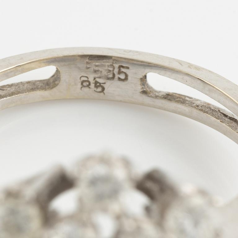 14K white gold and brilliant cut diamond cluster ring.