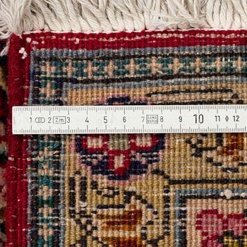 A Tabriz Carpet, circa 316 x 220 cm.