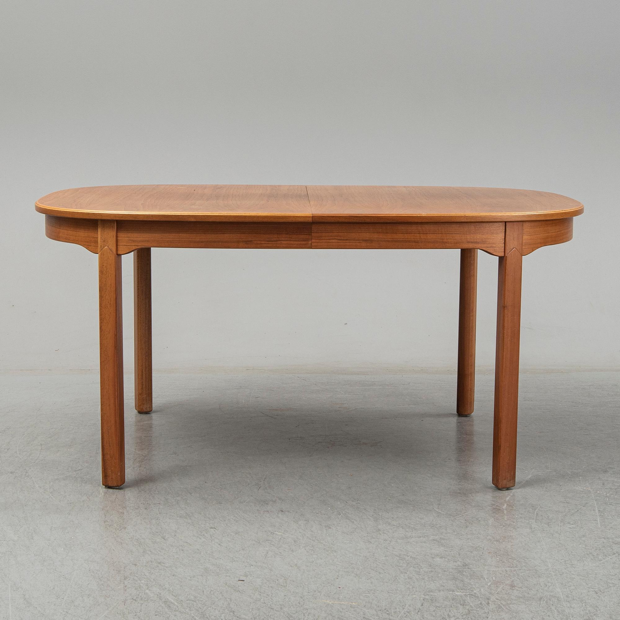 A five-piece walnut 'Ambassadör' dining suite by Carl Malmsten.