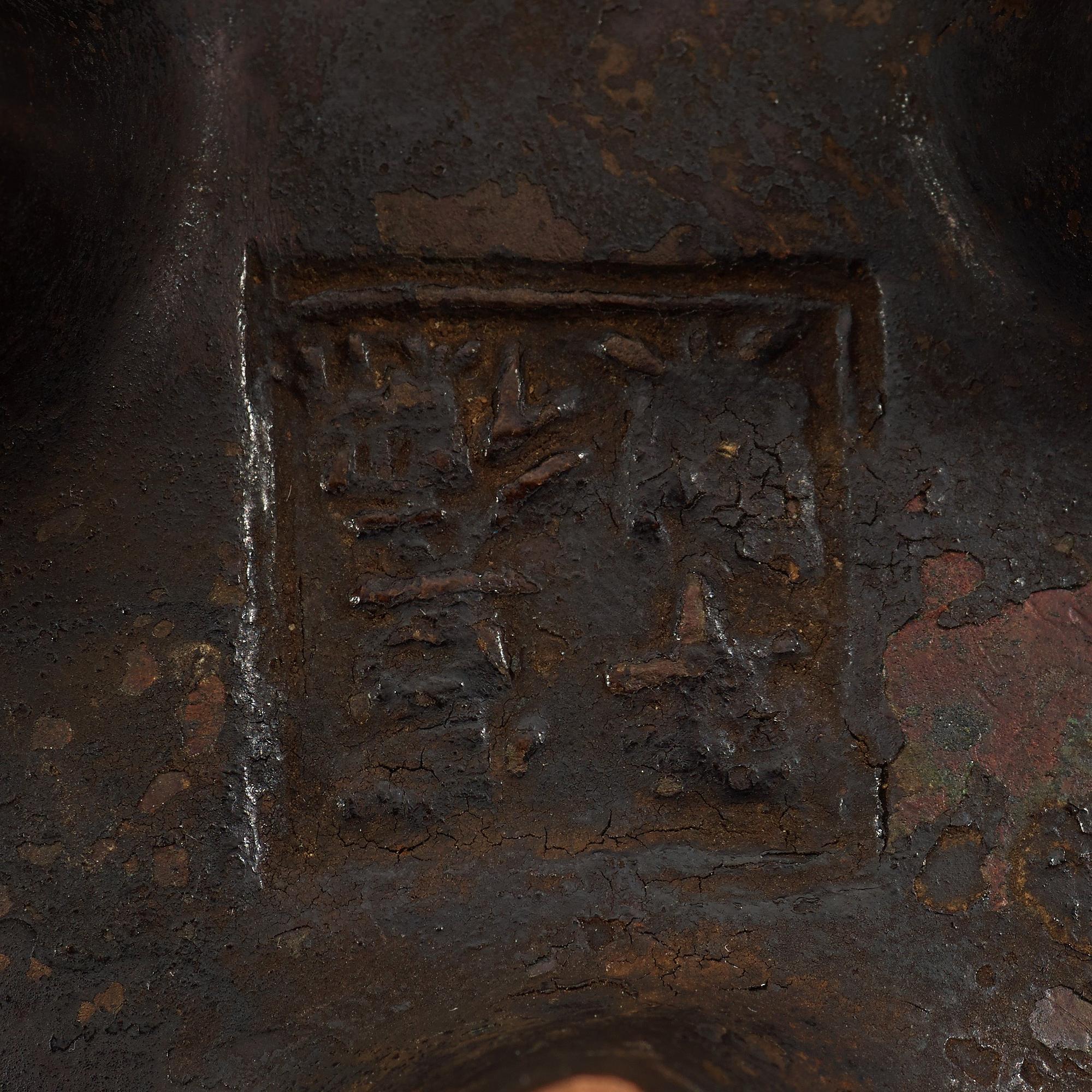 A copper alloy tripod censer, Ming dynasty, 17th Century with Xuandes four character mark.
