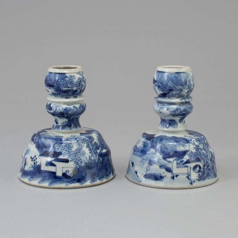 A pair of blue and white candlesticks, late Qingdynasty.