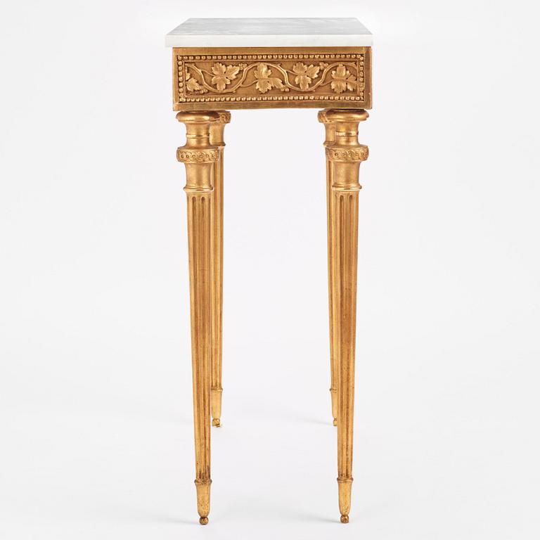 A late Gustavian carved giltwood and marble console table attributed to P. Ljung (1743-1819).