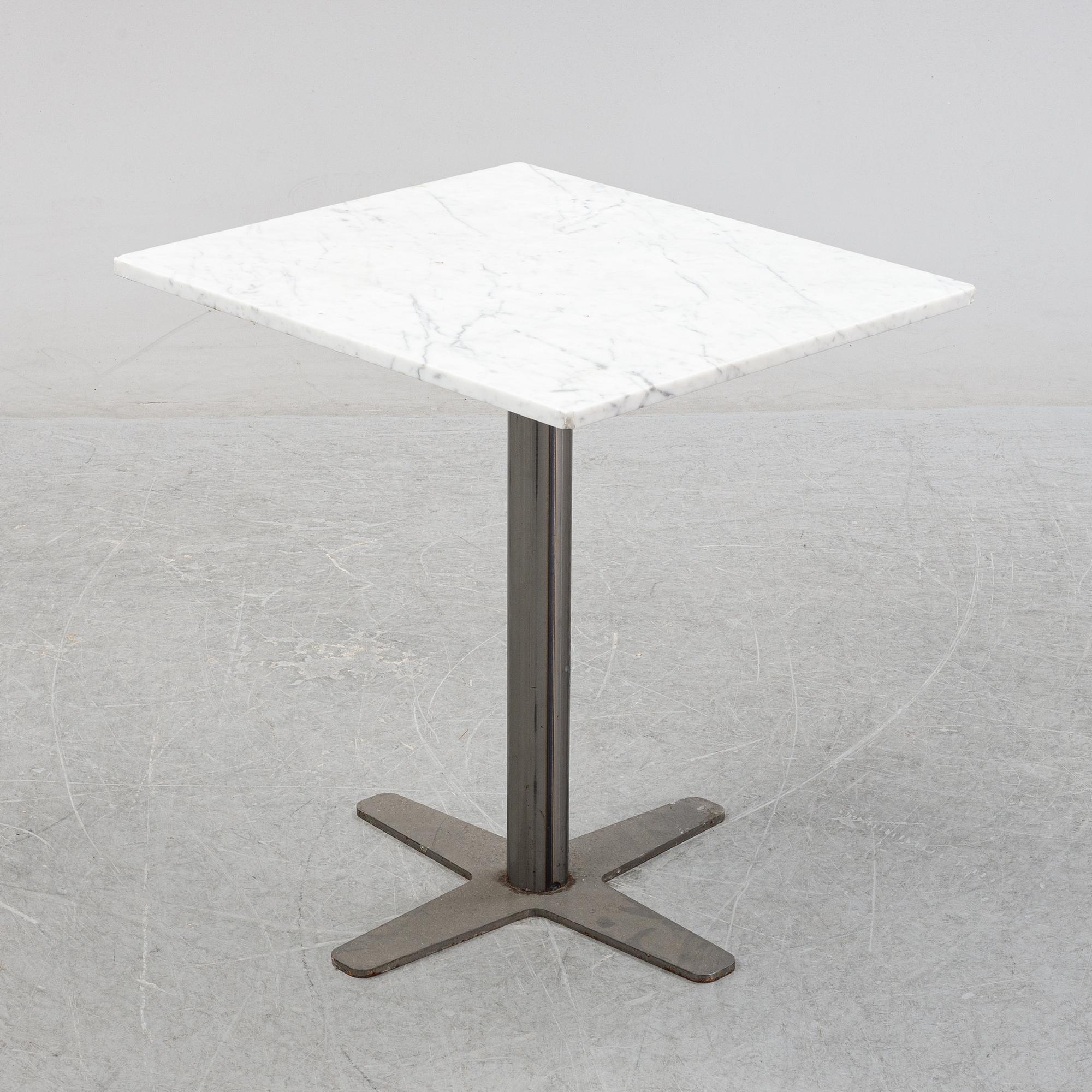A marble top table, 21th century.