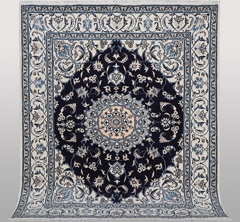A carpet, Nain, part silk, ca 256 x 199 cm.